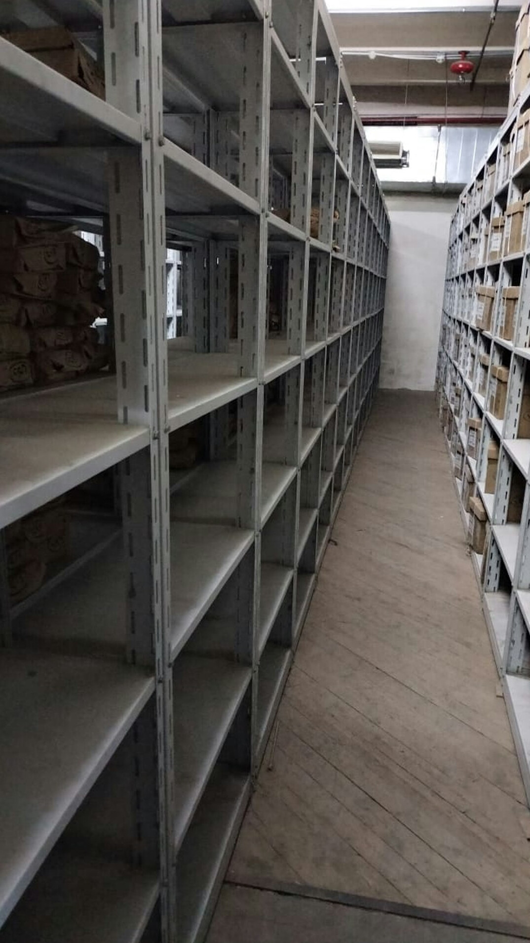 Archive room with shelves of document boxes