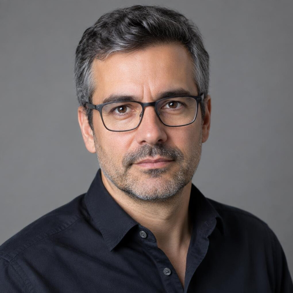 Studio portrait of a Portuguese man journalist in his 40s