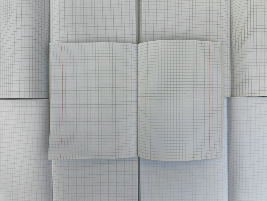 Stack of folded newspapers on a wooden table